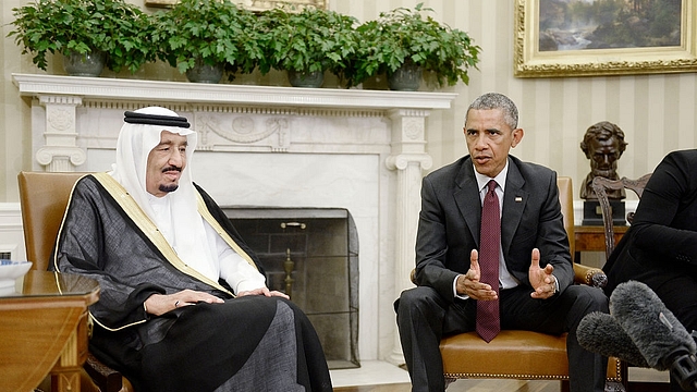 Former US President Barack Obama speaks as King Salman bin Abd al Aziz of Saudi Arabia looks on in the White House. (Olivier Douliery-Pool/Getty Images)