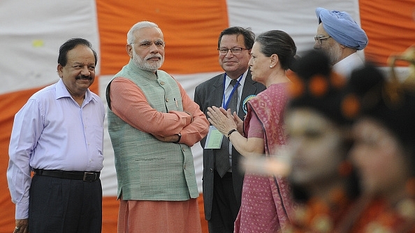 

 Prime Minister Narendra Modi interacts with Congress president Sonia Gandhi during Dussehra celebrations in 2014. (Sonu Mehta/Hindustan Times via Getty Images)