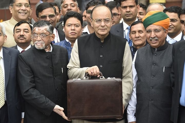 Finance Minister Arun Jaitley (centre) leaves his office to table the budget in Parliament in New Delhi last year. (DOMINIQUE FAGET/AFP/GettyImages)