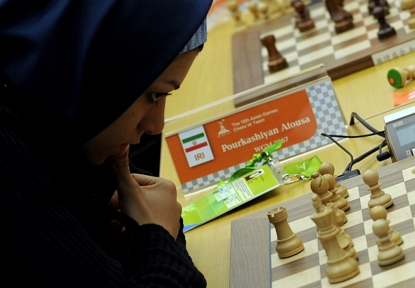 

Atous Pourkashiyan of Iran ponders a move  during an international tournament. (GOH CHAI HIN/AFP/GettyImages)