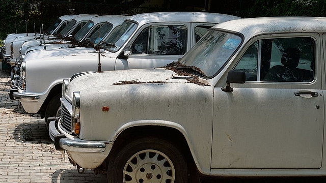 

Defunct Ambassador cars of the state government gather dust at a parking lot in Bengaluru.(MANJUNATH KIRAN/AFP/GettyImages)