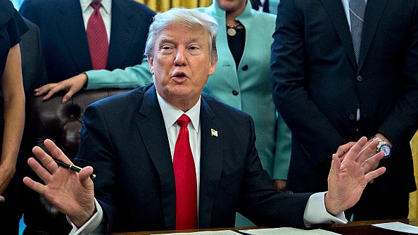 

Donald Trump signing an executive order. (Andrew Harrer - Pool/GettyImages)