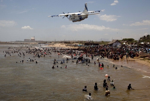 Hundreds of anti-nuclear activists participate in ‘Jal Satyagraha,’ by standing in the sea, to prevent loading of uranium fuel  the nuclear reactor of Koodankulam Nuclear Power Project. (STR/AFP/GettyImages)