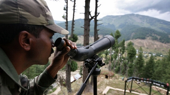 

A  soldier guards the line of control. (Farooq Khan-Pool/GettyImages)