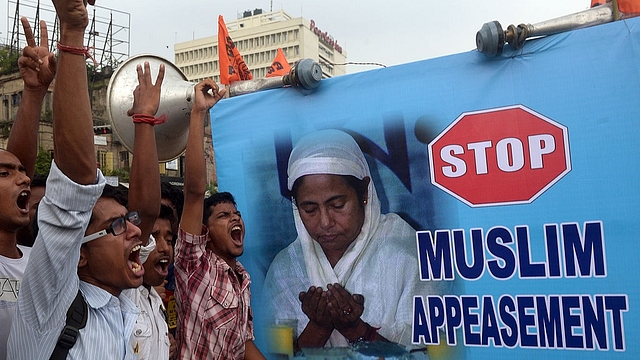 

Student activists protesting against pro-Muslim stand by the state goverment in all the educational schemes and organisations in the West Bengal state. (DIBYANGSHU SARKAR/AFP/Getty Images)