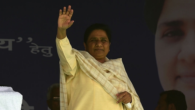 BSP leader Mayawati waves to the crowd upon her arrival at an election rally. (MONEY SHARMA/AFP/Getty Images)