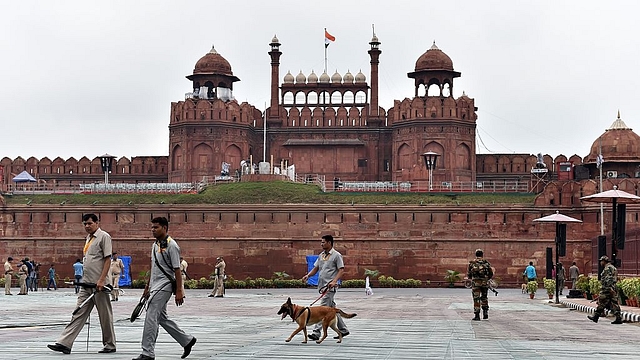 Security force personnel walk in front of the Red Fort in
New Delhi. (SAJJAD HUSSAIN/AFP/GettyImages)