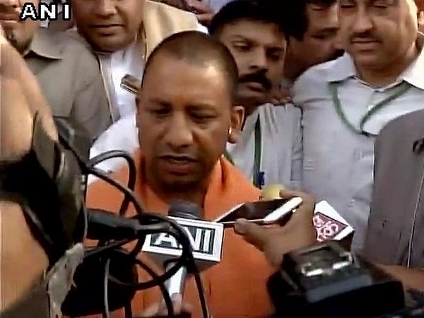 

Yogi Adityanath speaks to reporters.