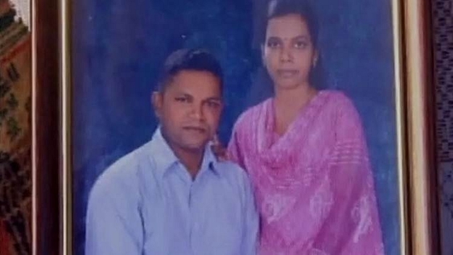 Soldier Roy Mathew with his wife in a photo at his house in Kollam, Kerala. (ANI photo)