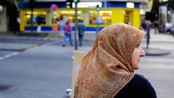 A Muslim woman waits to cross a street in Berlin’s Neukoelln district. (Sean Gallup/Getty Images)