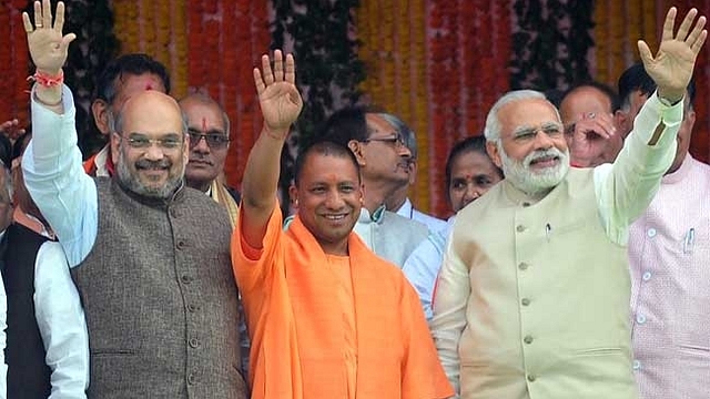 BJP President Amit Shah, Yogi Adityanath and Prime Minister Modi at an election rally in UP.