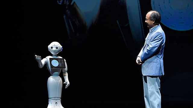 

Pepper and Masayoshi Son, Chairman and Chief executive officer of SoftBank Corp talk during the news conference in Chiba, Japan. (Koki Nagahama/Getty Images)