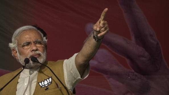 Prime Minister Narendra Modi gestures while speaking to the crowd at a rally in Sidhuali, near Lucknow, India. (Kevin Frayer/Getty Images)