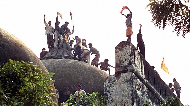 Youth demolishing Babri Masjid.