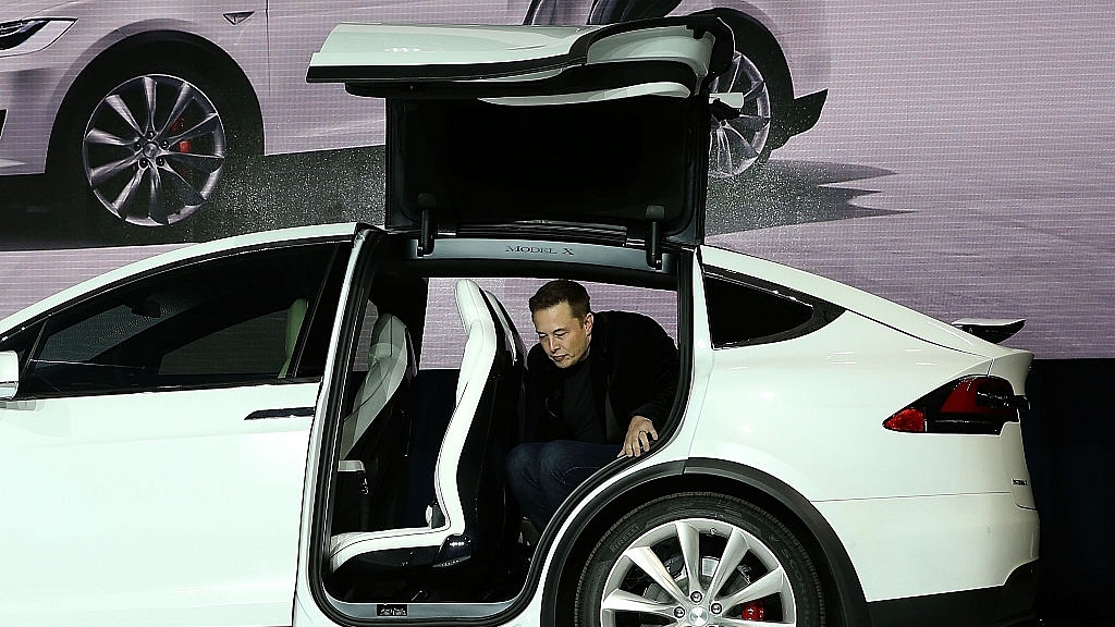 

Tesla CEO Elon Musk steps out of the new Tesla Model X during an event to launch the company’s new crossover SUV on September 29, 2015 in Fremont, California. (Justin Sullivan/Getty Images)