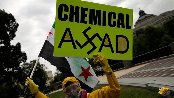 A protester on the street against use of chemical weapons by Assad against his own people in Syria. (Win McNamee/Getty Images)