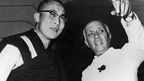 Tibetan spiritual leader the Dalai Lama and former Indian Prime Minister Jawaharlal Nehru in New Delhi. (Central Press/Getty Images)