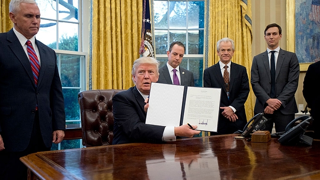 

U.S. President Donald Trump shows the Executive Order withdrawing the US from the Trans-Pacific Partnership (TPP)  (Ron Sachs - Pool/Getty Images)