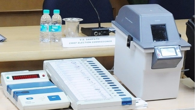 Image of a Voter Verifiable Paper Audit Trail (VVPAT) machine with an EVM, or electronic voting machine. (Photo Via PIB)