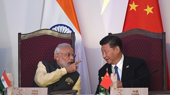 Prime Minister Narendra Modi  talking with China’s President Xi Jinping during the BRICS leaders’ meeting  in Goa. (PRAKASH SINGH/AFP/Getty Images)