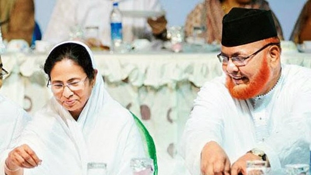 West Bengal Chief Minister Mamata Banerjee, left, with Imam Barkati. (PTI)

