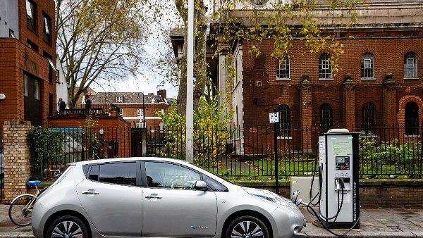 A Nissan Leaf charging at a public charging point (Miles Willis/Stringer)