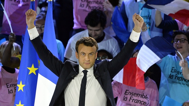 Macron greets voters before a political meeting at Grande Halle de La Villette in Paris.(Aurelien Meunier/GettyImages)