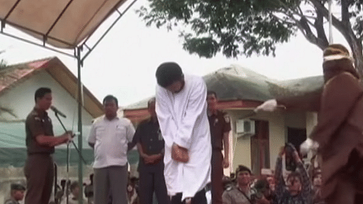 Islamic Shariah In Action: Two Gay Men Caned In Indonesia As Crowd Cheers