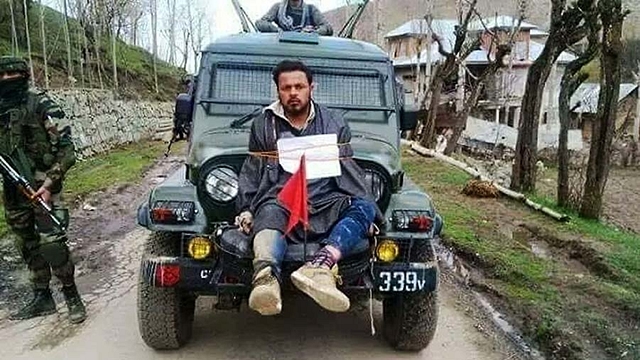 

                  
Farooq Ahmad Dar, a resident of Kashmir’s Beerwah town, tied to an army vehicle. 


                

