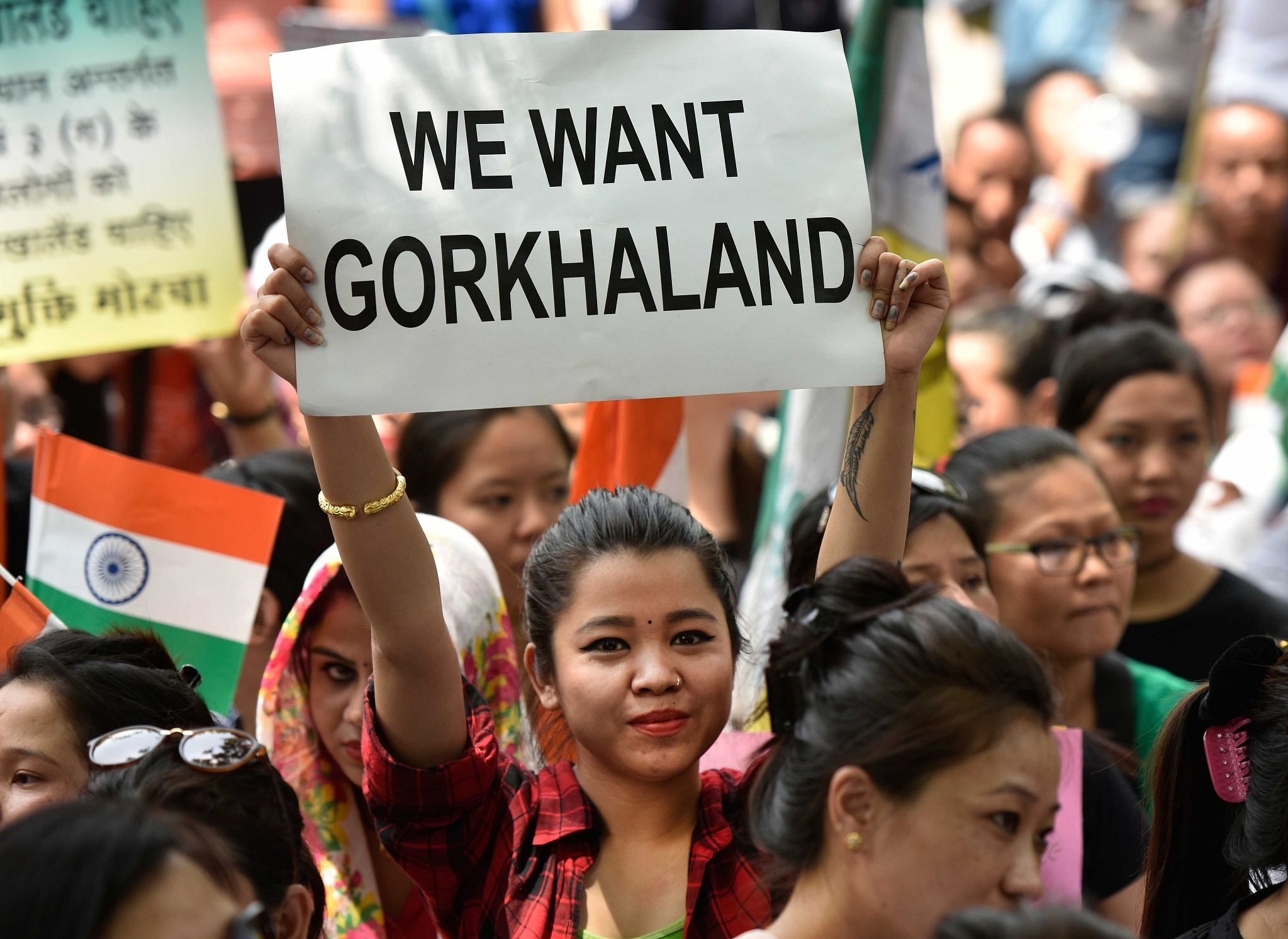 A girl holds a placard during the ongoing Gorkhaland protests (Ravi Choudhary/Hindustan Times via Getty Images)