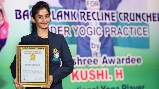 Khushi set the world record for performing Poorna Chakrasana