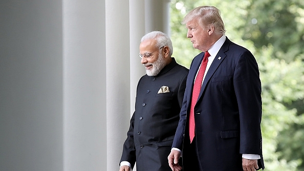 US President Donald Trump and Prime Minister Narendra Modi walk from the Oval Office to deliver joint statements in the Rose Garden of the White House. (Win McNamee/Getty Images)