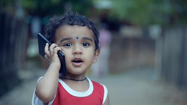 A child speaking on a mobile phone. (Pixabay)