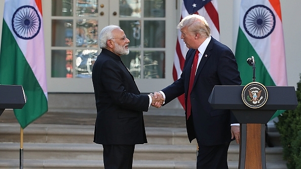 US President Donald Trump and
Indian Prime Minister Narendra Modi shake hands before delivering joint
statements in the Rose Garden of the White House on 26 June in Washington. (Mark
Wilson/GettyImages)