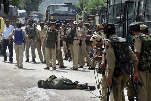 An LeT terrorist lies on the road after being shot by security forces. (ANI)