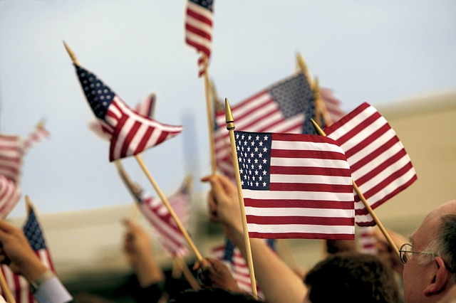 
US citizens celebrate after taking the oath of citizenship. 

