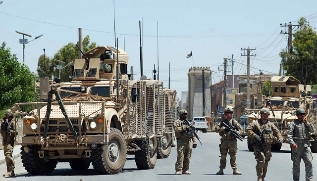 
US soldiers stop traffic on the road to the Governor’s compound in Kandahar.

