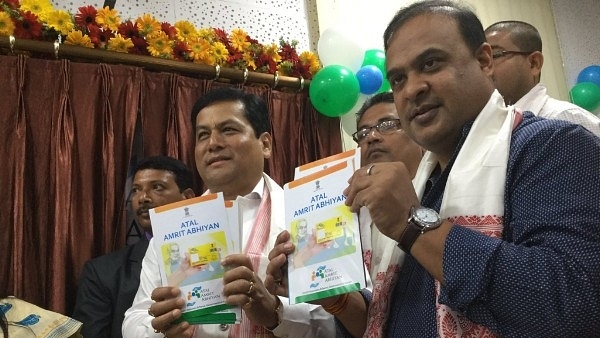 Assam Chief Minister Sarbananda Sonowal and Minister Himanta Biswa Sarma at the launch of Atal Amrit Abhiyan, a health assurance scheme for the poor. (Himanta Biswa Sarma/Twitter)