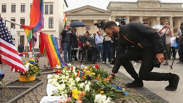 A mourner attends a vigil for victims of a shooting at a gay nightclub in Orlando, Florida, in front of the United States embassy in Berlin, Germany. (Adam Berry/Getty Images)