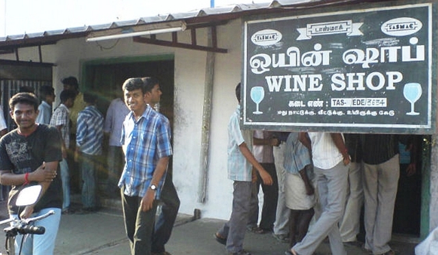 People lined up outside a TASMAC outlet.