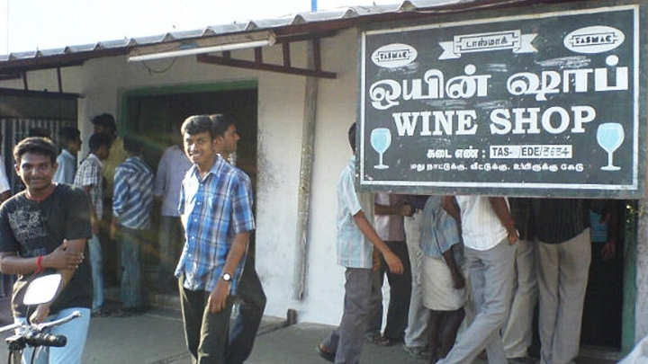 People lined up outside a TASMAC outlet.