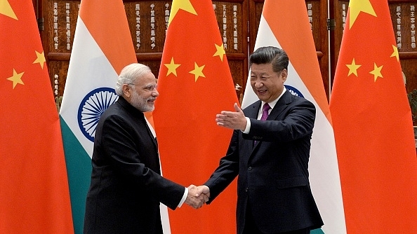 Indian Prime Minister Narendra Modi with Chinese Premier Xi Jinping (Wang Zhou - Pool/Getty Images)