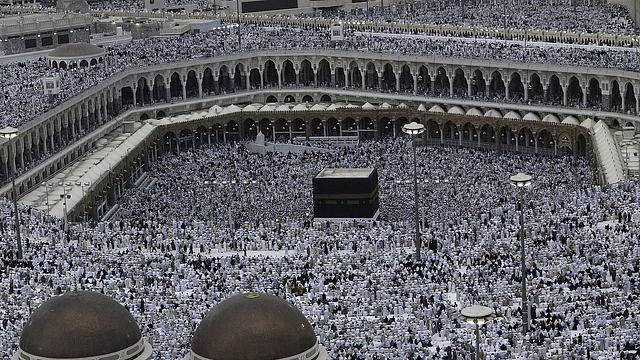 

Muslim pilgrims pray the evening prayer inside the Grand Mosque and Holy Kabba, the holiest places for Muslims around the world  (Muhannad Fala’ah/Getty Images)