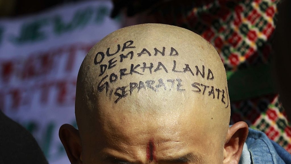 A Gorkha activist takes
part in a demonstration demanding a separate Gorkhaland state in the Darjeeling.
(Vipin Kumar/Hindustan Times via GettyImages)<b></b>