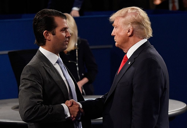 
 Donald Trump, Jr.  greets his father 
 Donald Trump. (Saul Loeb-Pool/Getty Images)

