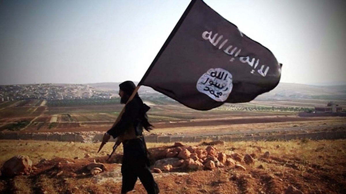 ISIS fighter with a flag