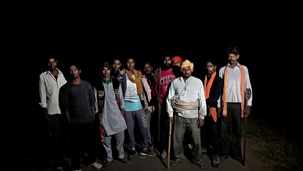 Members of a cow vigilante group pose for a photograph out on a patrol in the hopes of stopping vehicles of cow smugglers in Ramgarh, Rajasthan (2015). (Allison Joyce/Getty Images)