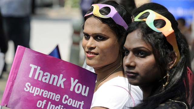 Transgender rights activists hold placards during the one-year celebration of the Supreme Court judgement recognising the transgenders as
‘third gender’ at Jantar Mantar in New Delhi. (Sonu Mehta/Hindustan Times via
GettyImages)