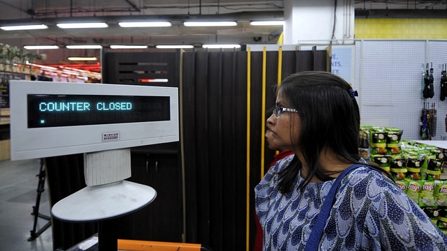 ‘Counter closed’ sign is displayed at a supermarket after huge rush was seen hours before the introduction of good and services tax on 1 July. (Sunil Ghosh/Hindustan Times via GettyImages)