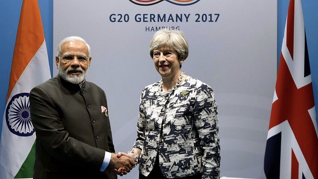 PM Modi meets British PM Theresa May on the sidelines of G-20 summit (<a href="https://twitter.com/MEAIndia/status/883645109199306752">MEA photo</a>)